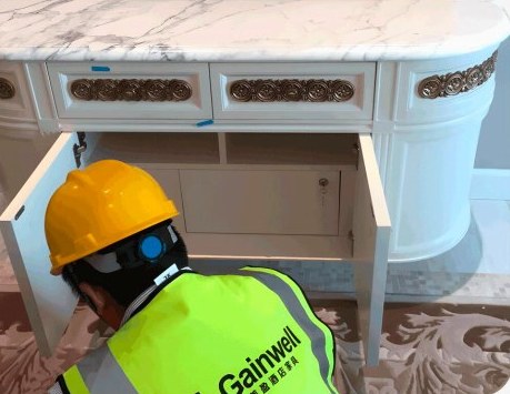 Technician fitting a vanity on site