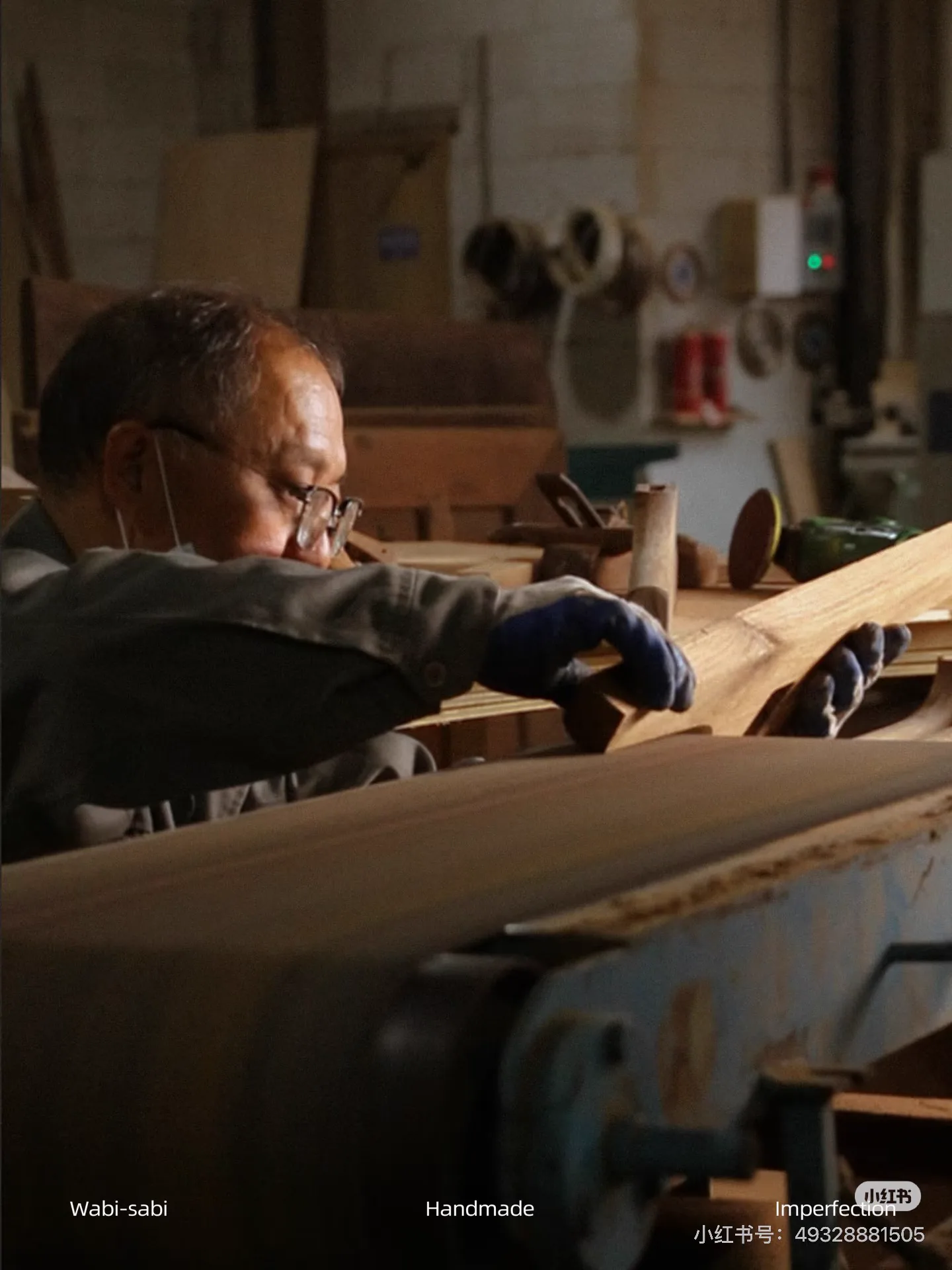 Master craftsman shaping solid wood in a Foshan workshop
