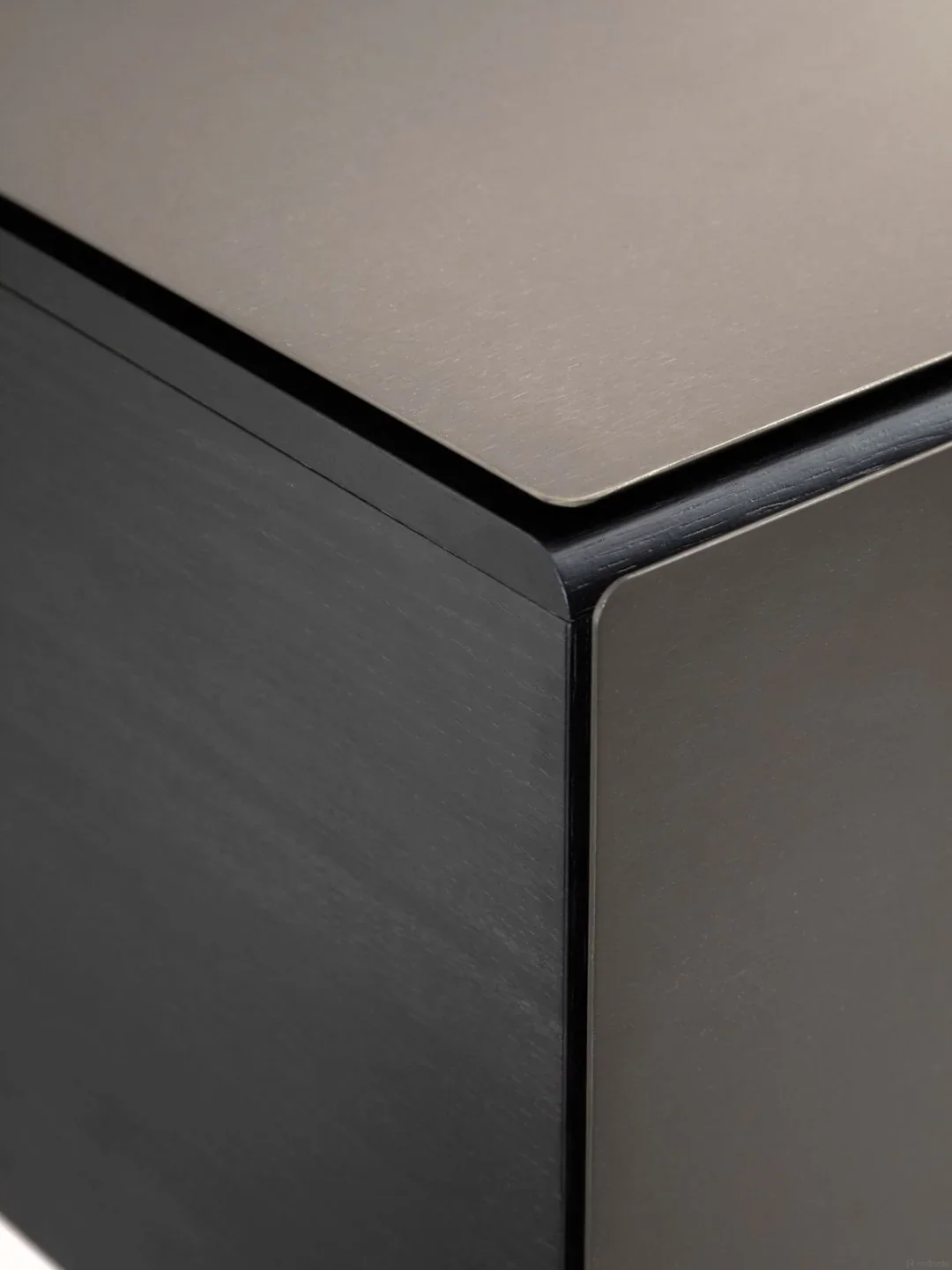 Black oak and brushed metal cabinet corner
