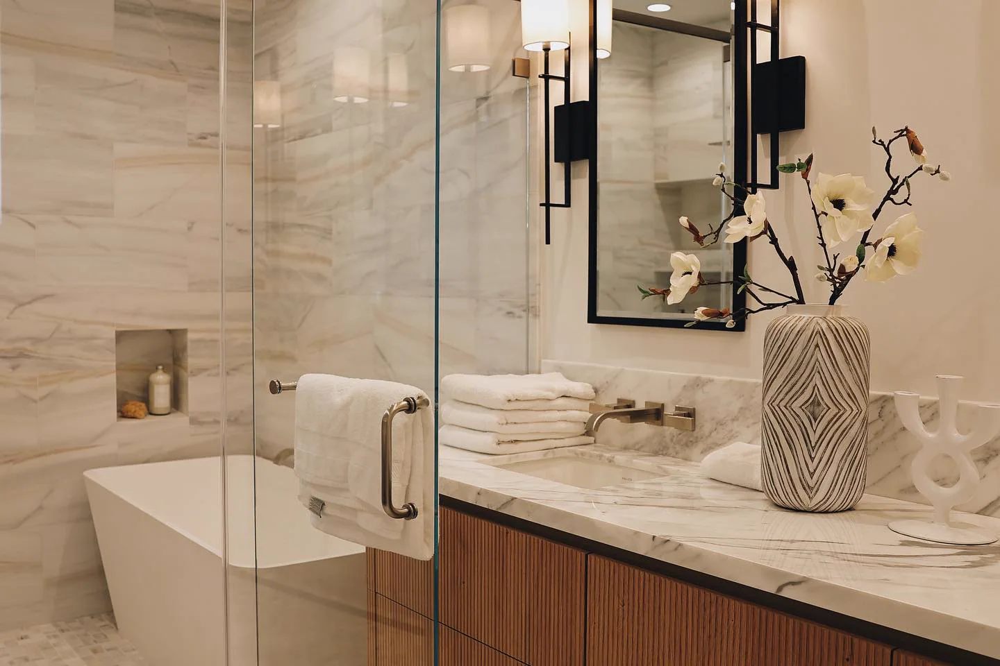 Bathroom with quartz vanity top and walnut cabinetry