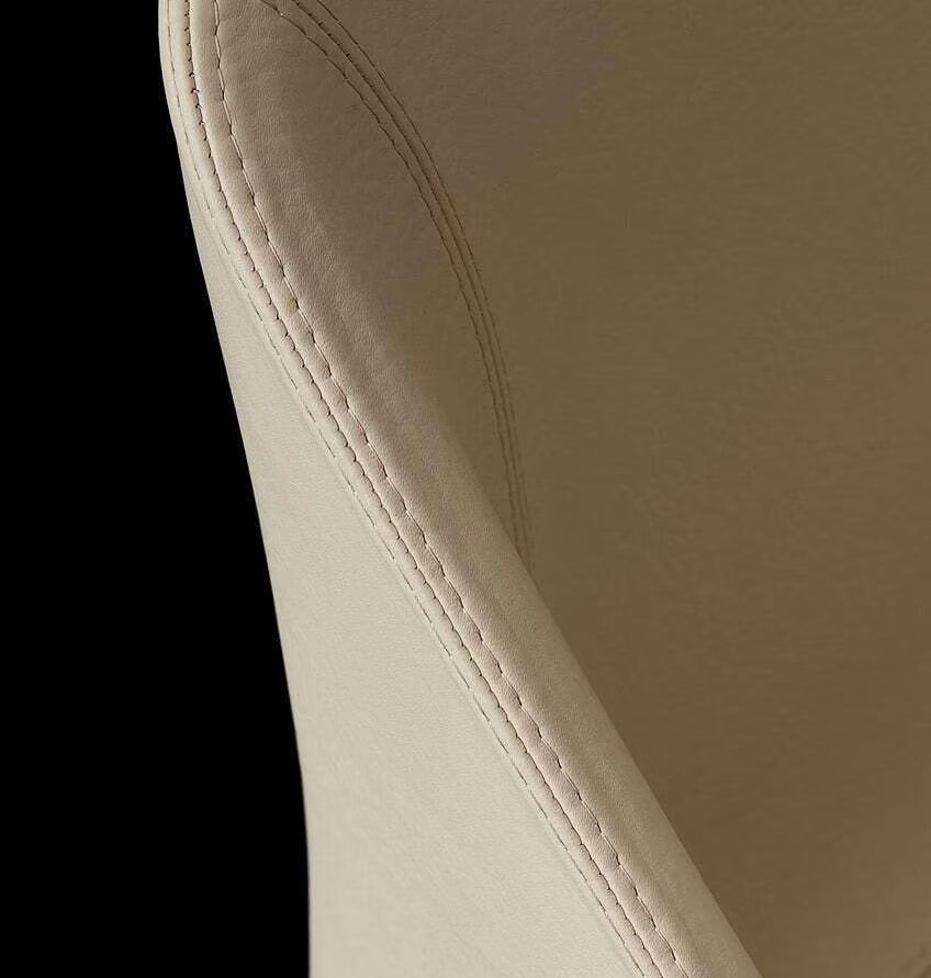 Precision leather stitching on a chair back