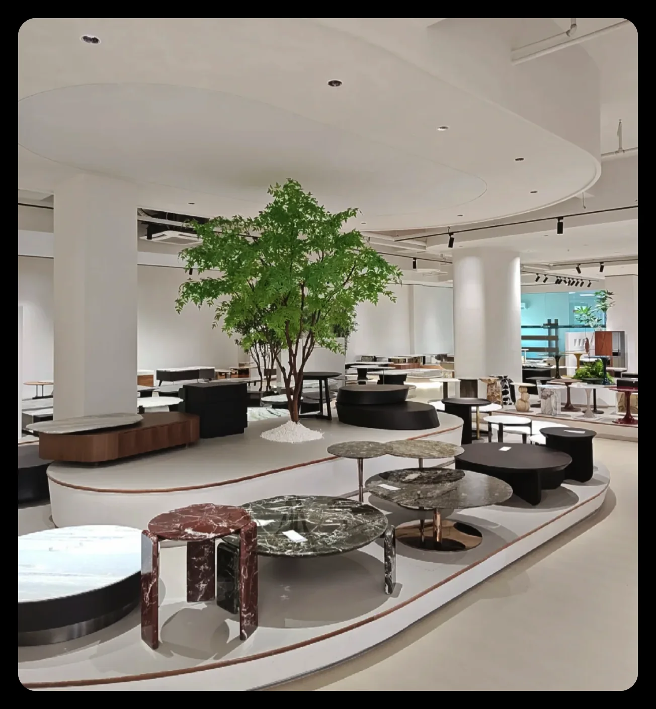 Dining tables on display in a Foshan furniture showroom