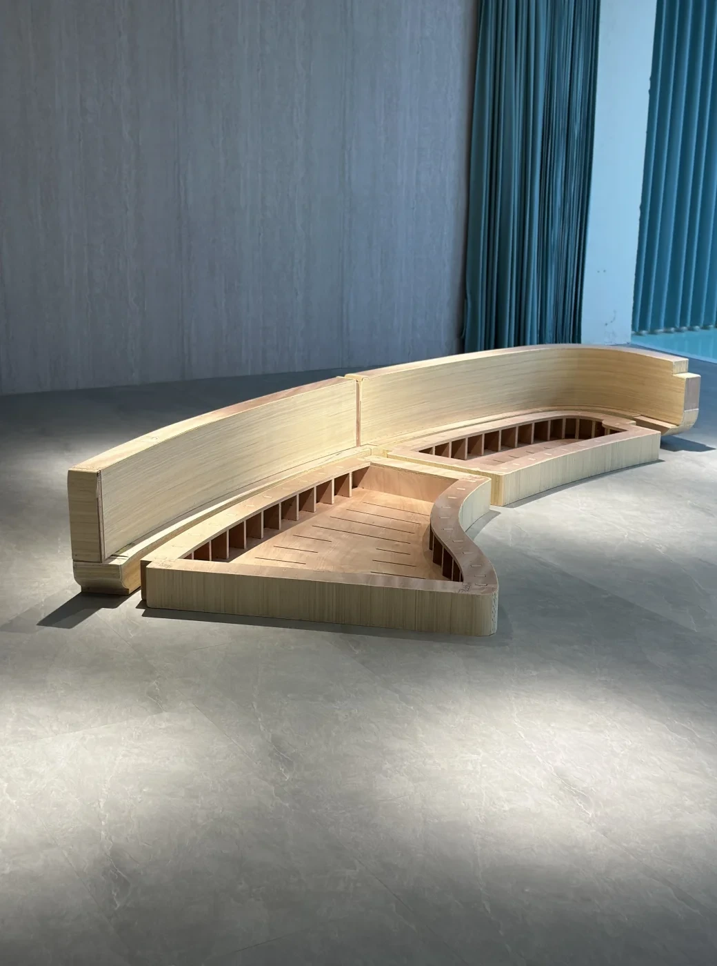Curved sofa frame showing solid wood structure and internal bracing