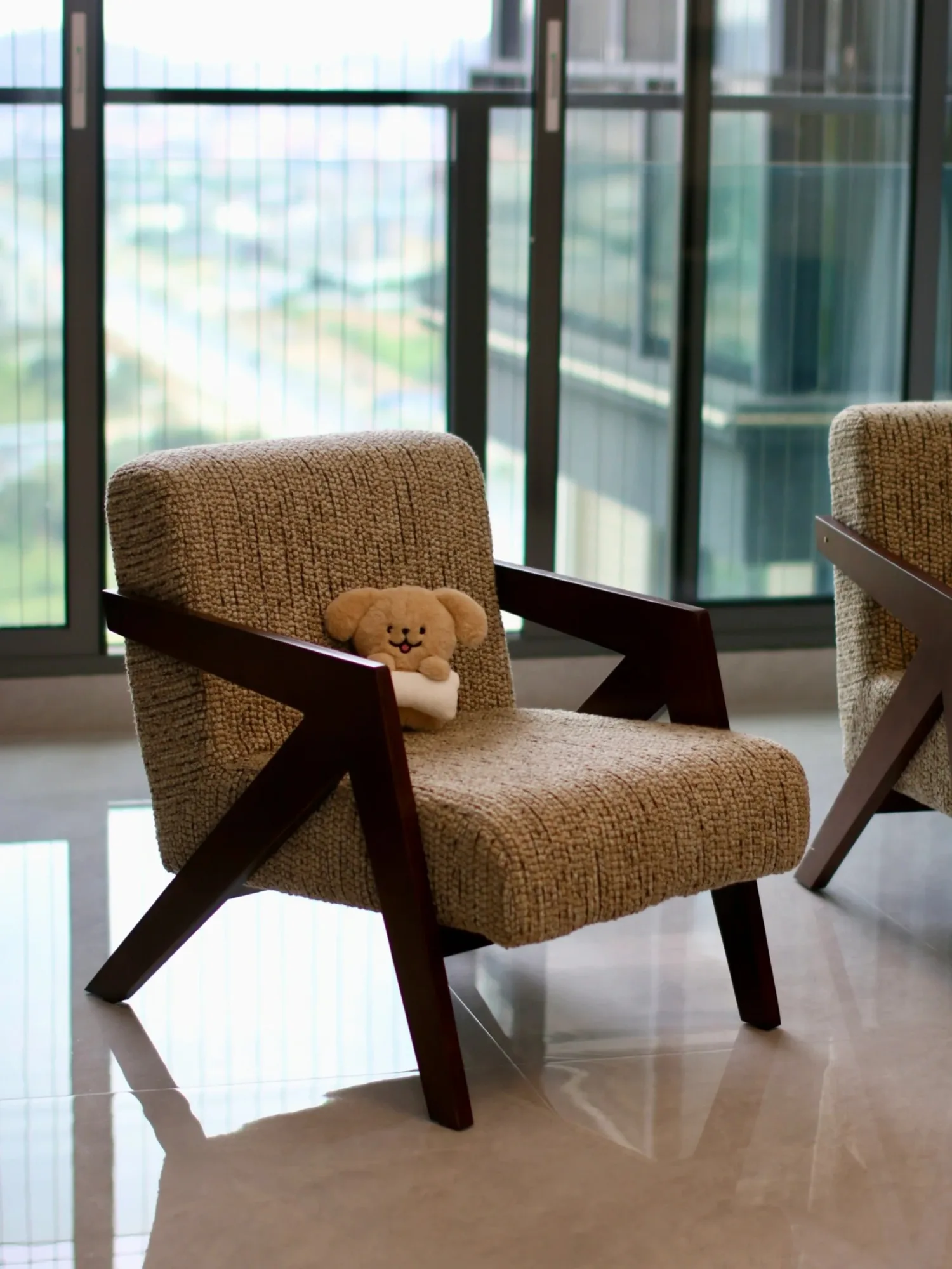 Upholstered wood frame lounge chair with angled arms
