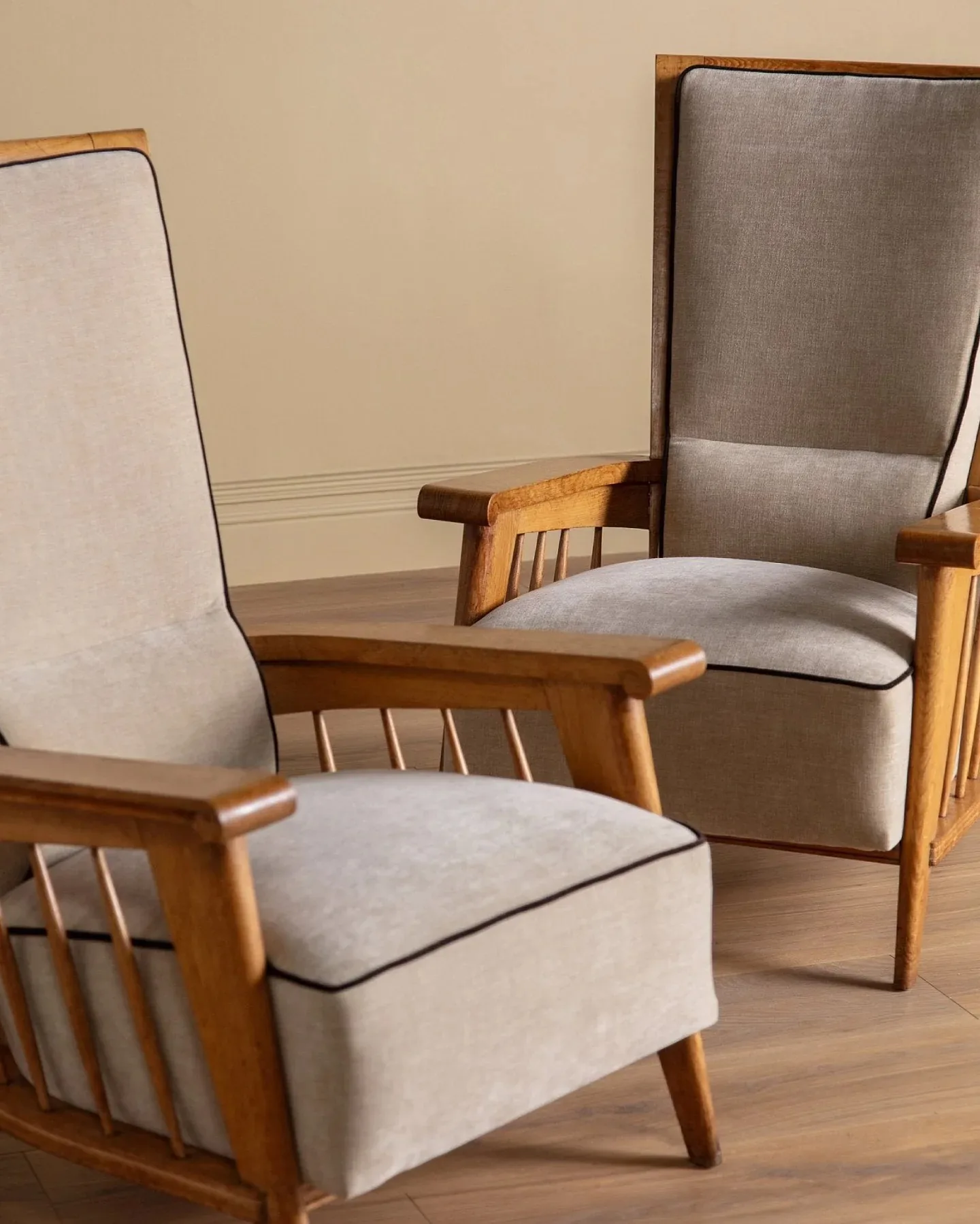Pair of high back wood lounge chairs