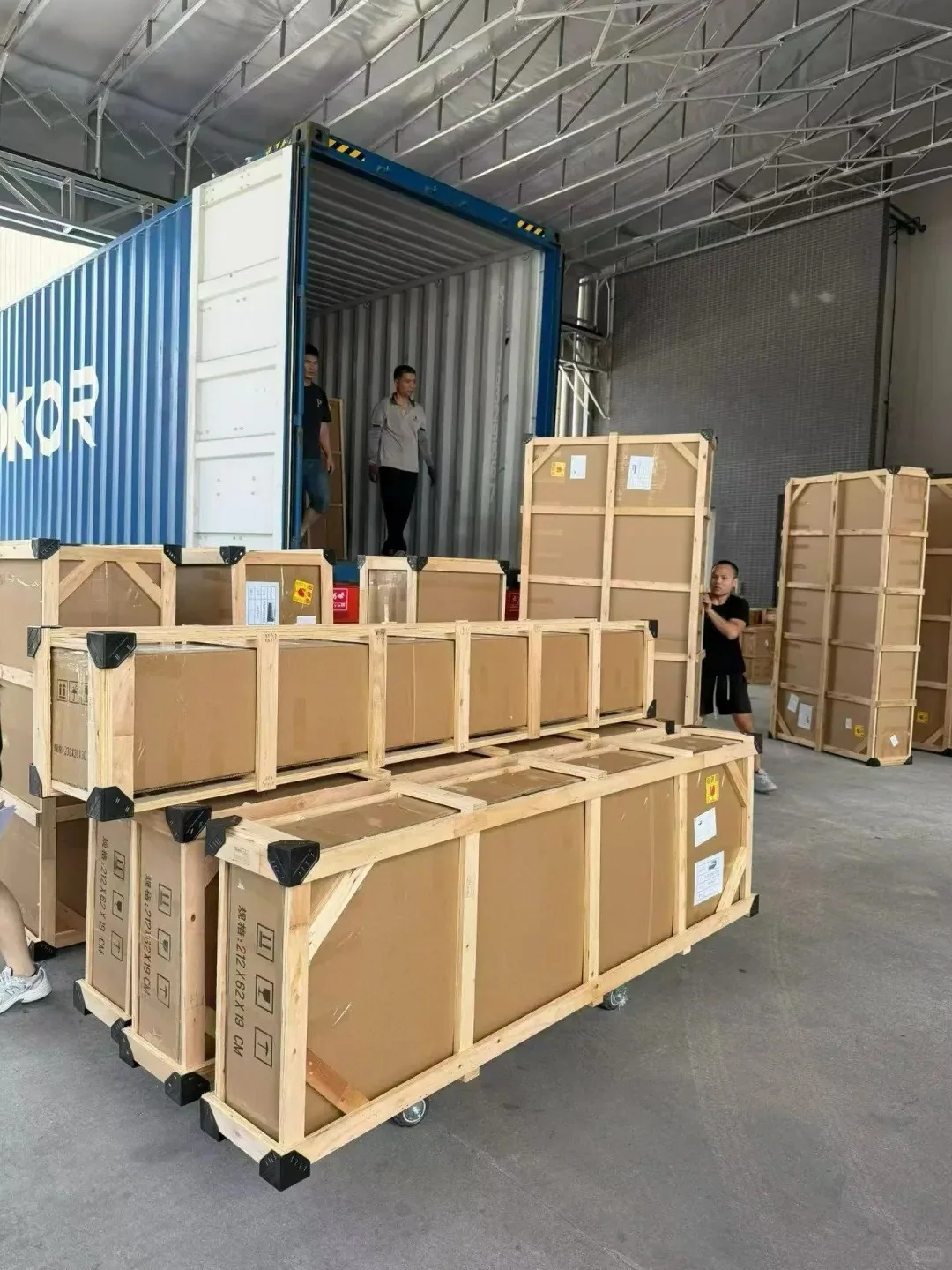 Export packing and container loading photo with reinforced wooden crates for furniture