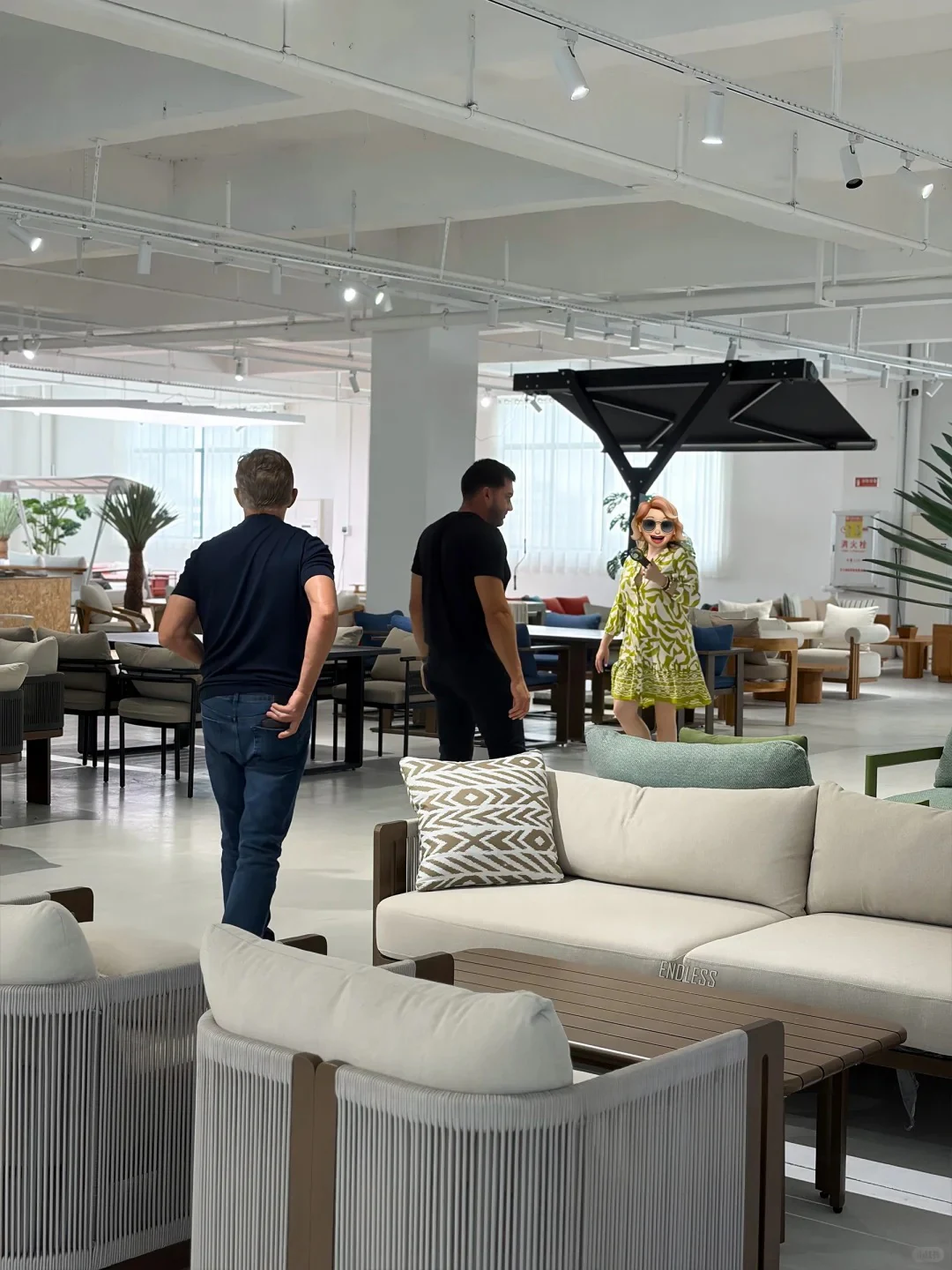 Buyer visit inside a multi-category furniture showroom