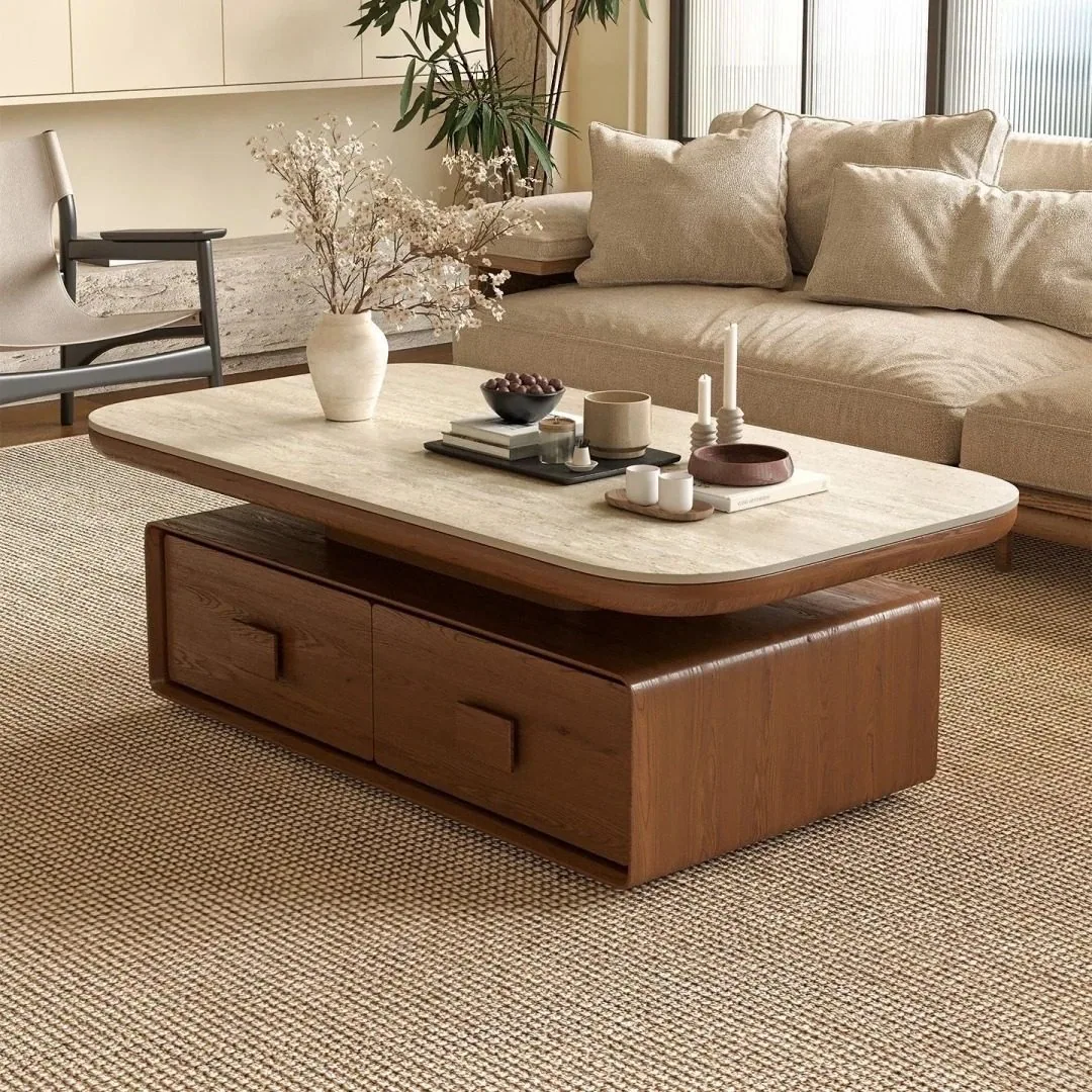 A coffee table with a light stone top and warm wood storage base.