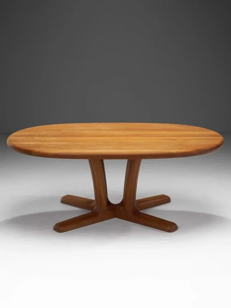 A round wood table on a clean studio background.