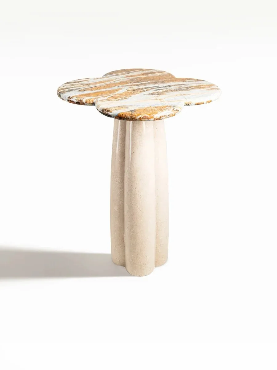 Full product view of a clover-shaped stone side table.