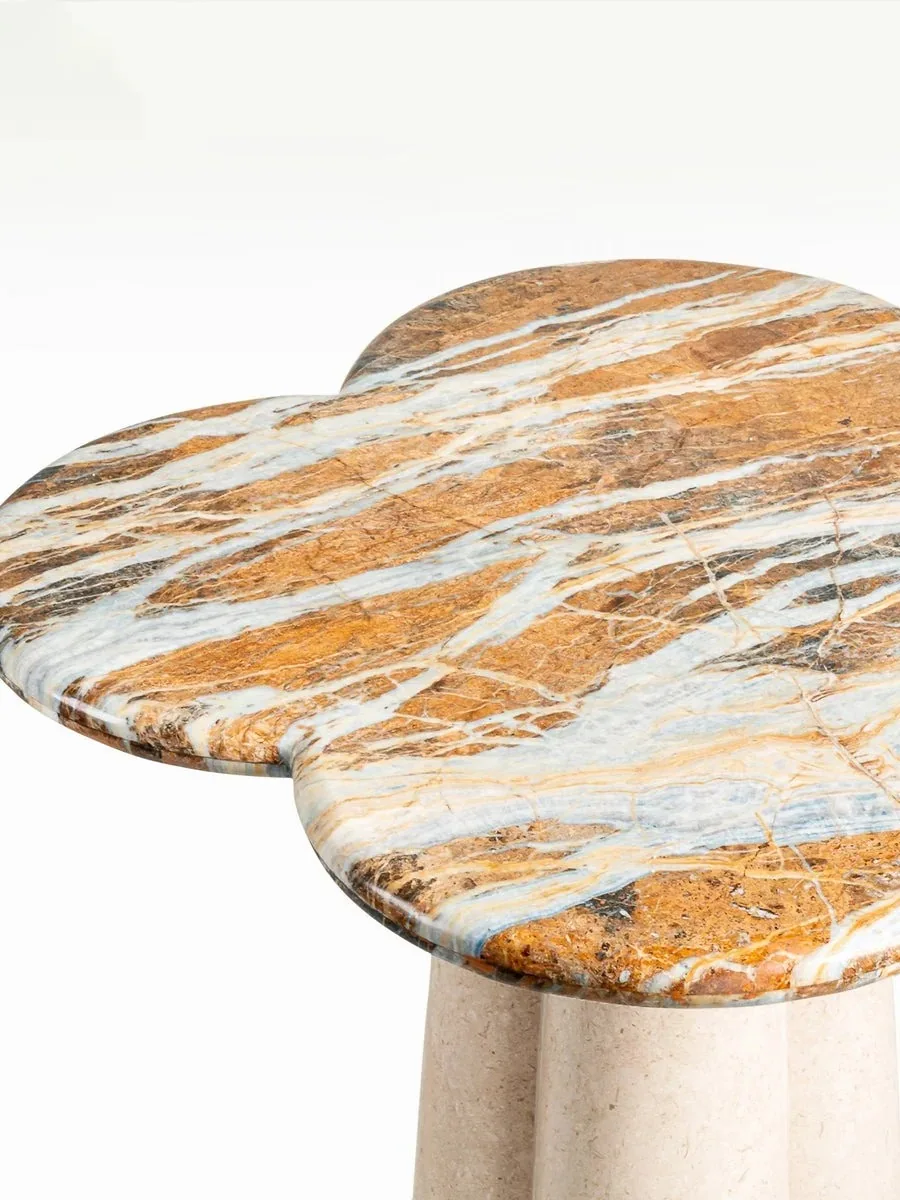 Top-angle close-up of a stone side table.