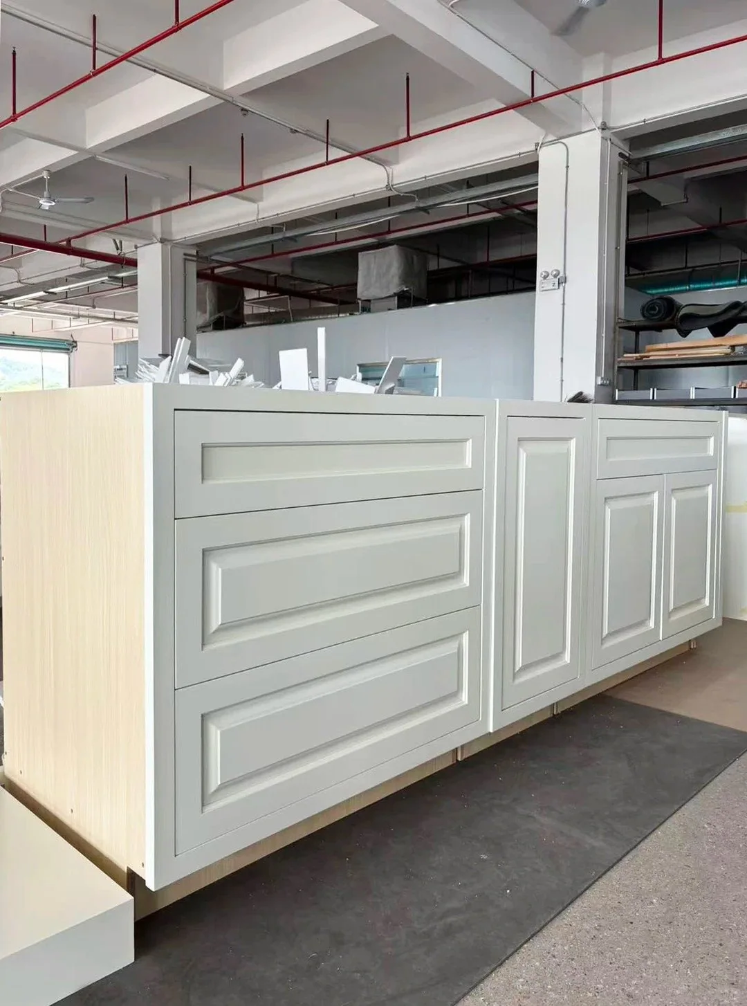 Custom inset cabinet modules pre-assembled in a furniture factory