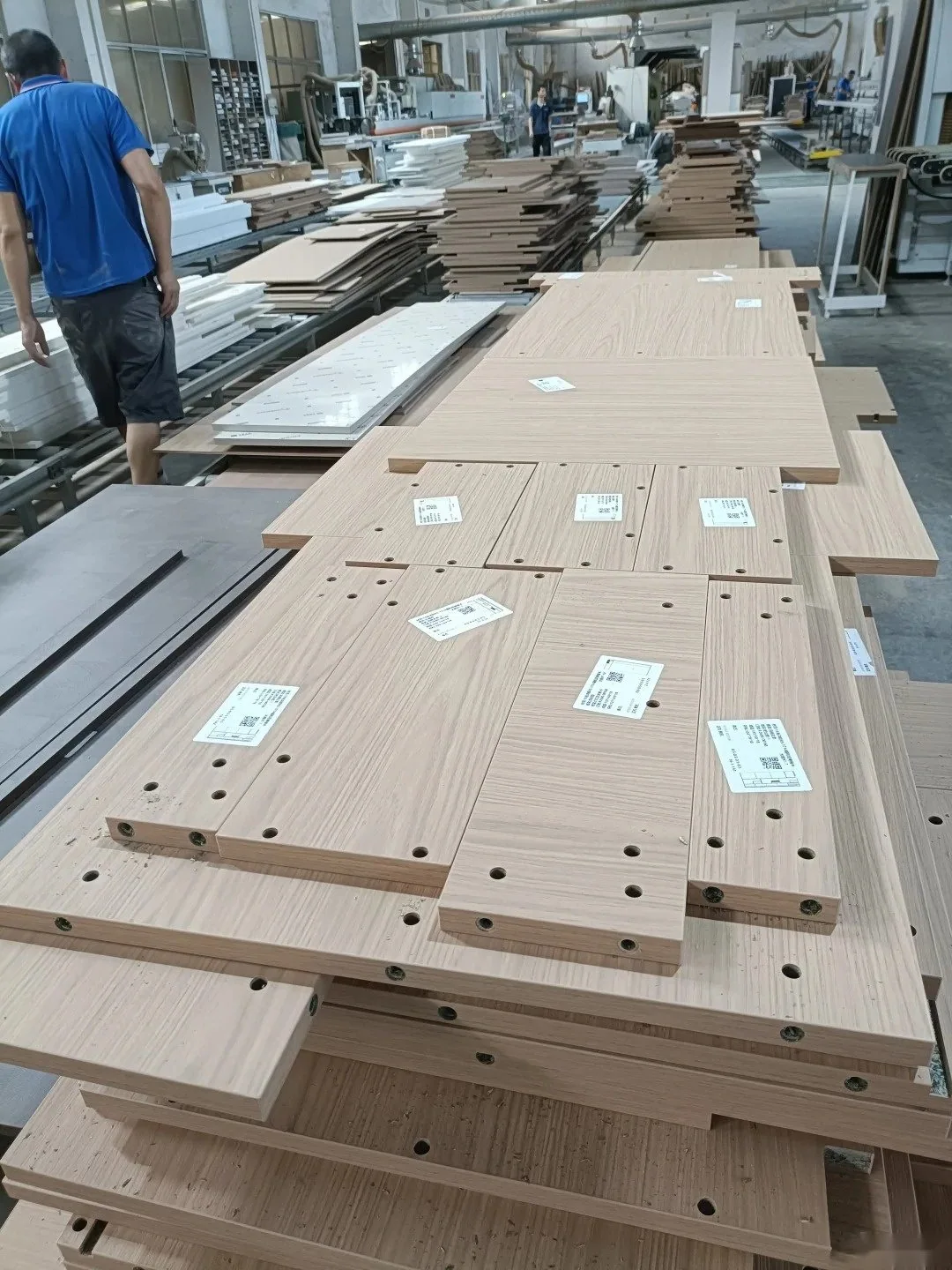 Cabinet panels prepared and labeled on a factory production line