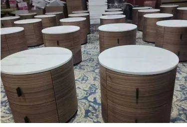 Factory display of round wood nightstands
