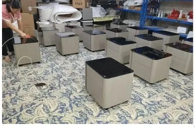 Factory floor with compact nightstands featuring dark tops