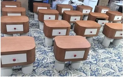 Factory display of brown and white nightstands