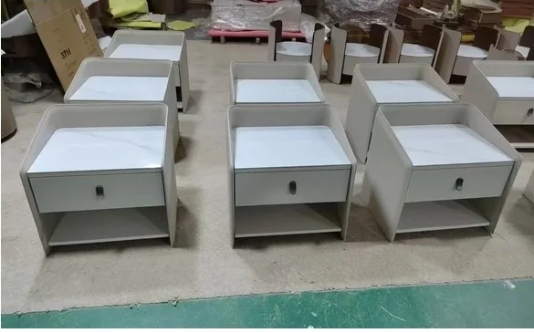 Factory display of gray drawer nightstands