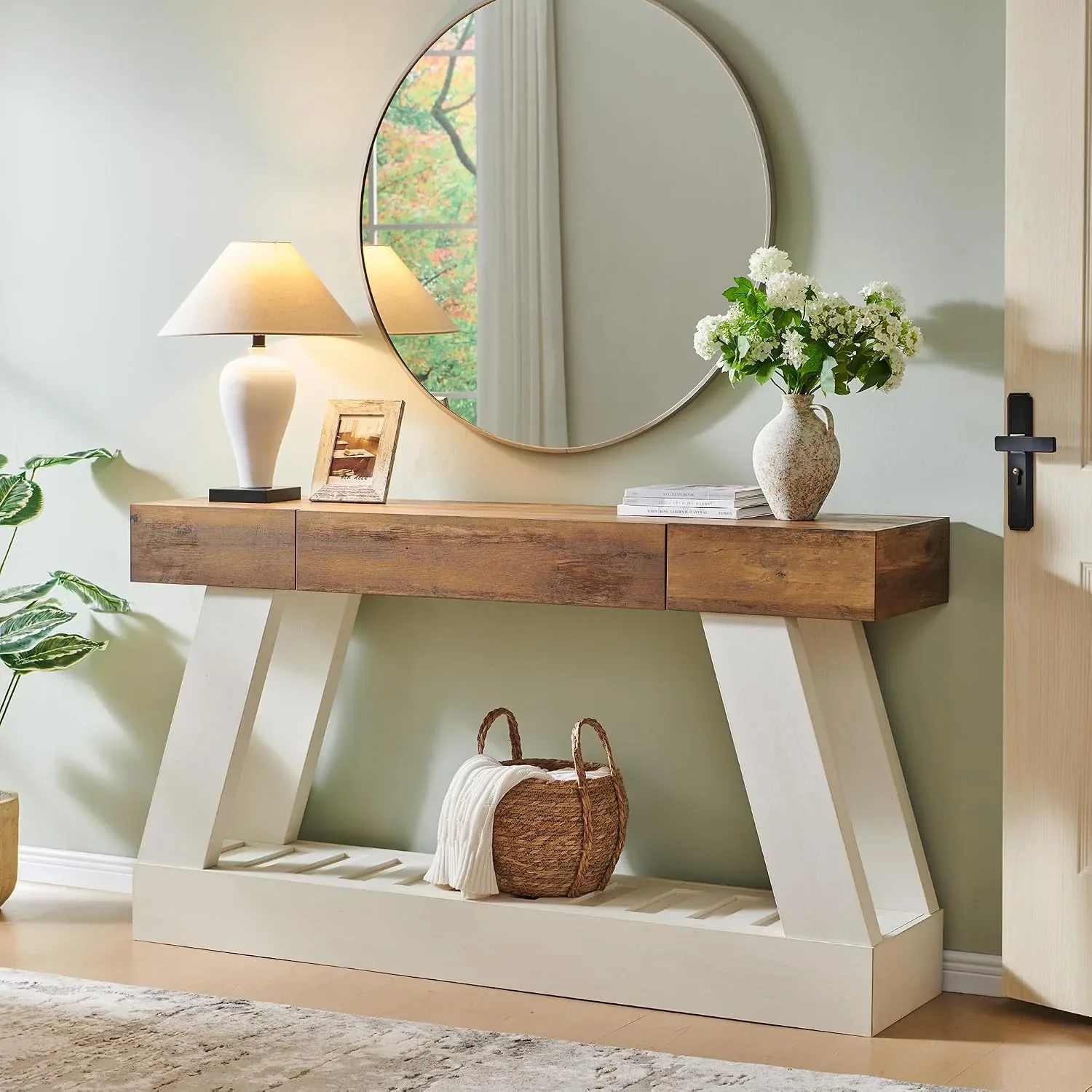 Two-tone wood console with open lower shelf in a relaxed entryway