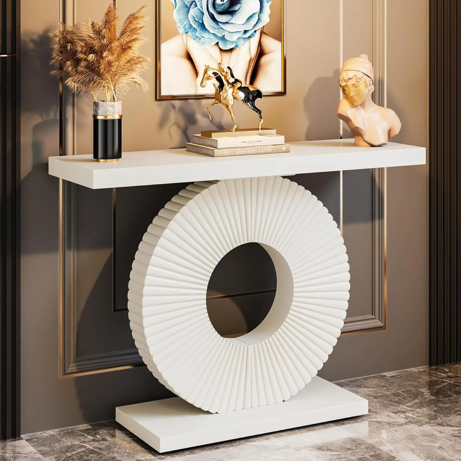 White sculptural circular console table in a glamorous entry setting