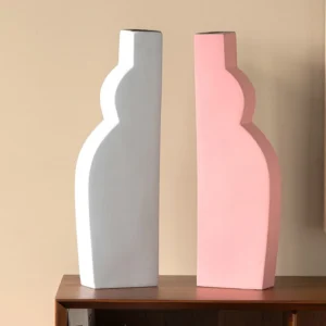 Abstract Curved Silhouette Ceramic Vases in White and Pink — front view