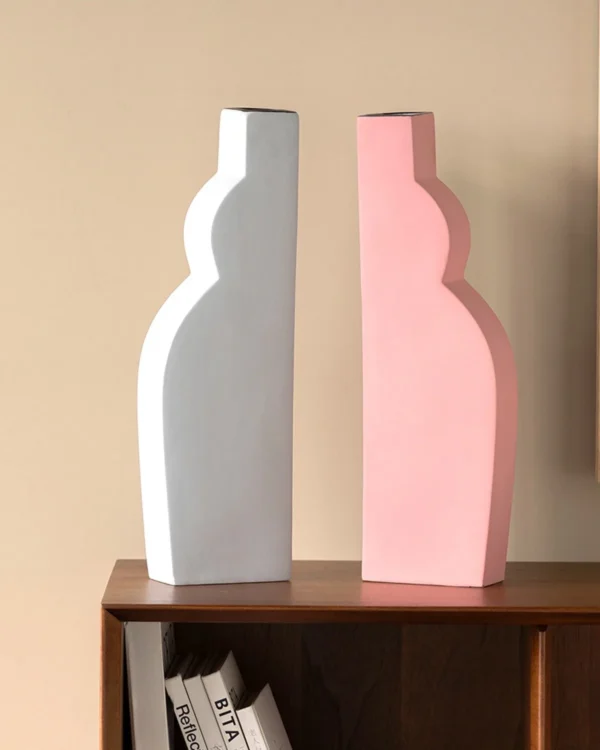 Abstract Curved Silhouette Ceramic Vases in White and Pink — in a room setting