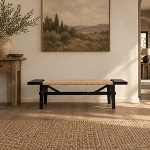 Across Black Wood Bench with Woven Rattan Seat in black — in a room setting