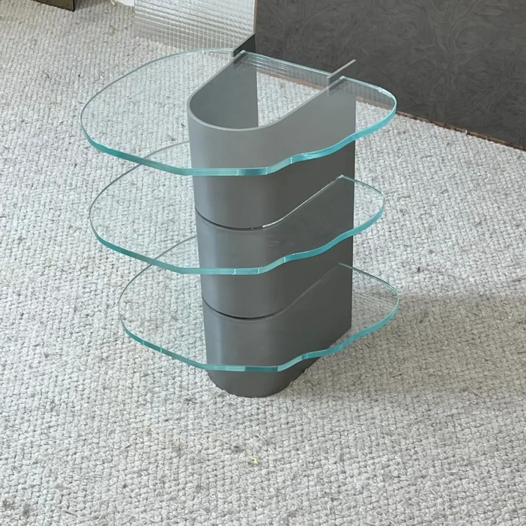 Three-Tier Glass Side Table on Curved Grey Metal Spine in slate — front view