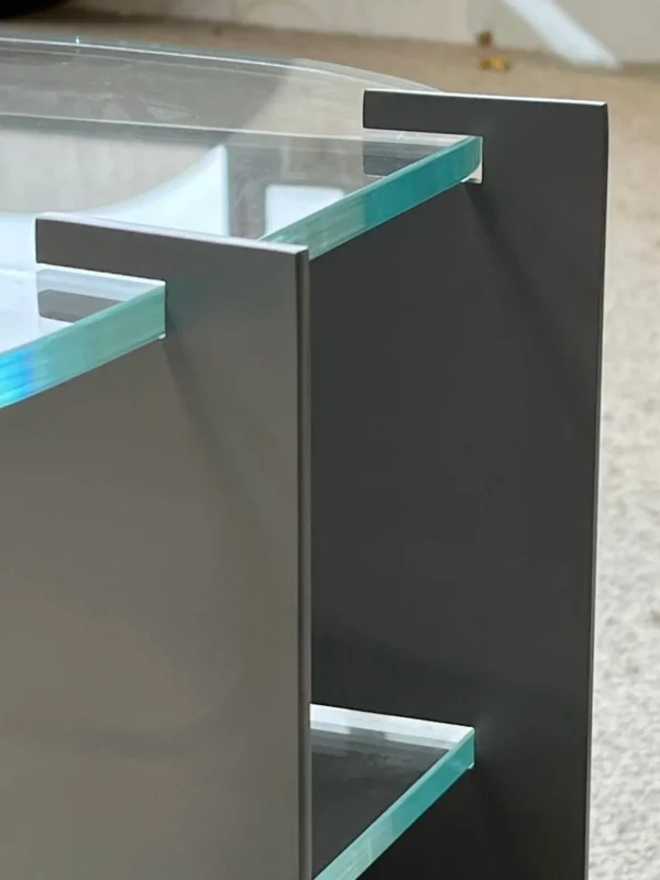 Three-Tier Glass Side Table on Curved Grey Metal Spine in slate — detail