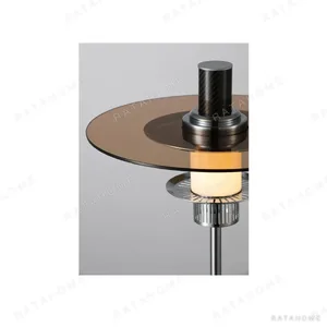 Amber Glass Disc Table Lamp on Chrome and Marble Base in clay — in a room setting