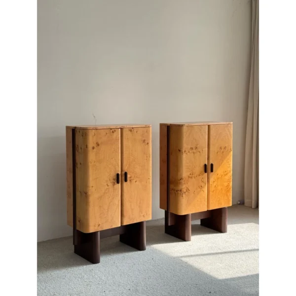 Amber Burl Veneer Curved Cabinet Pair on Dark Wood Legs in mustard — in a room setting