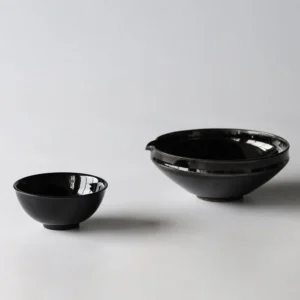 Artist Collaboration Black Gold Glaze Porcelain Bowls in black — front view