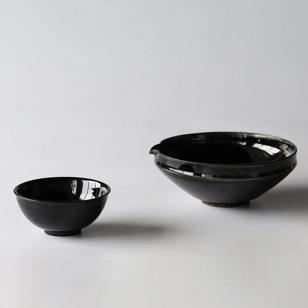 Artist Collaboration Black Gold Glaze Porcelain Bowls in black — front view