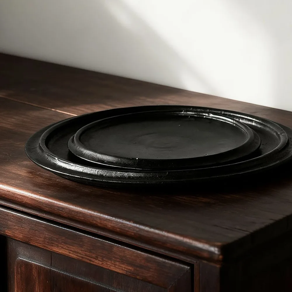 Handmade Black Swirl Stoneware Plates in black — front view