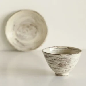 Artist Collaboration Brushed Ceramic Conical Bowl and Plate in ivory — front view