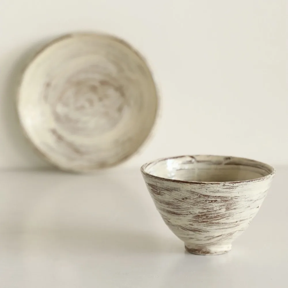Artist Collaboration Brushed Ceramic Conical Bowl and Plate in ivory — front view