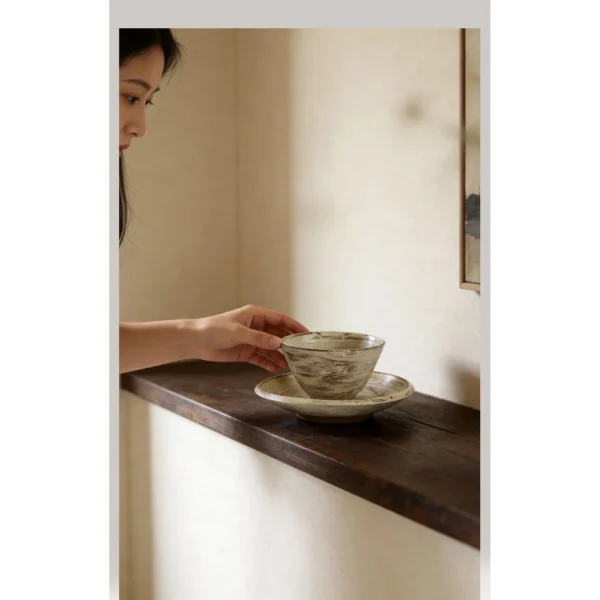 Artist Collaboration Brushed Ceramic Conical Bowl and Plate in ivory — in a room setting