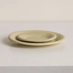 Artist Collaboration Oval Ceramic Plates in Pale Straw Glaze — front view