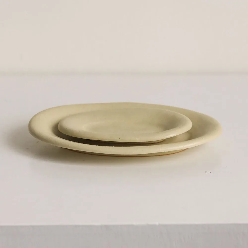Artist Collaboration Oval Ceramic Plates in Pale Straw Glaze — front view