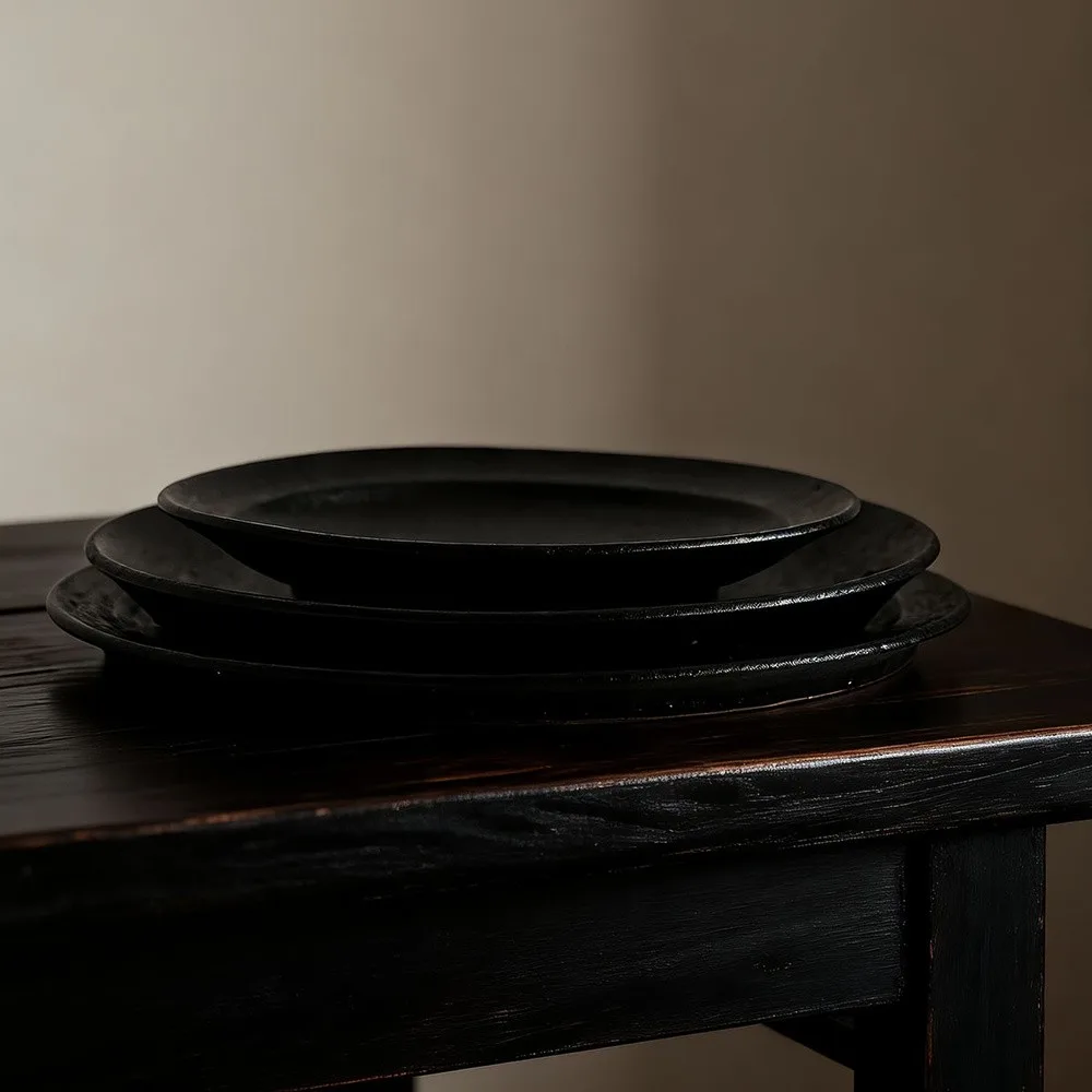 Artist Collaboration Black Stoneware Dinner Plates in black — front view
