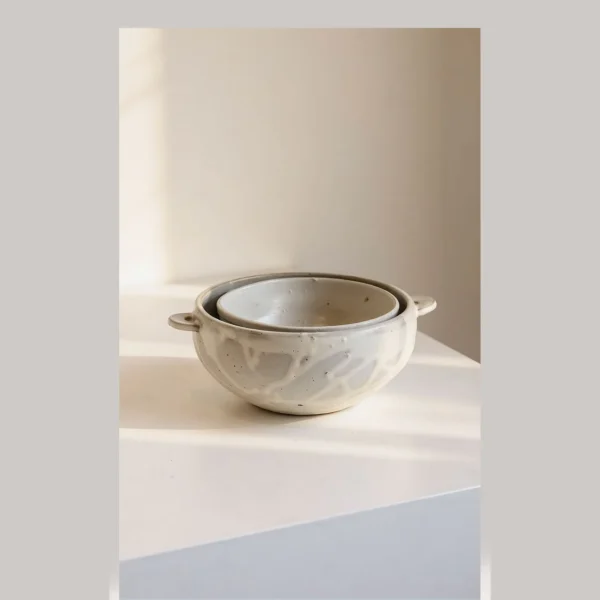 Artist Collaboration Stoneware Spouted Large Bowl with Ears in ivory — in a room setting