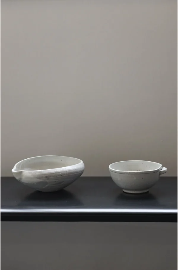 Artist Collaboration Stoneware Spouted Large Bowl with Ears in ivory — in a room setting