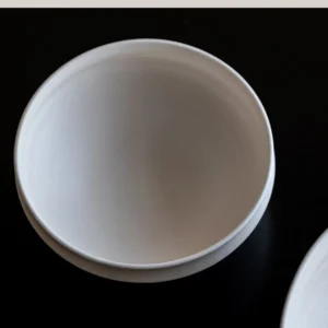 Artist Collaboration Folded-Edge Cone-Base Ceramic Bowls in ivory — front view