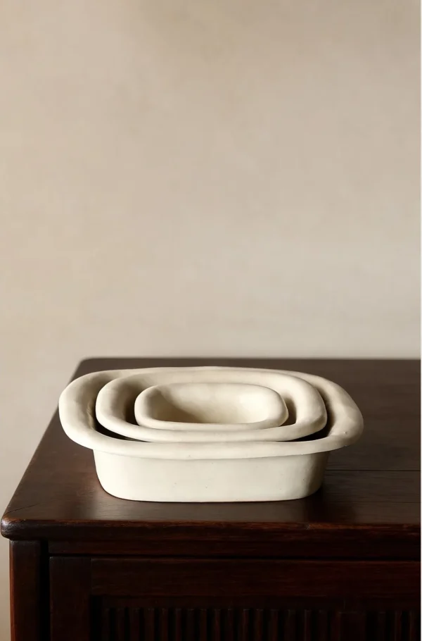 Artist Collaboration Folded-Edge Square Ceramic Dishes in oatmeal — in a room setting
