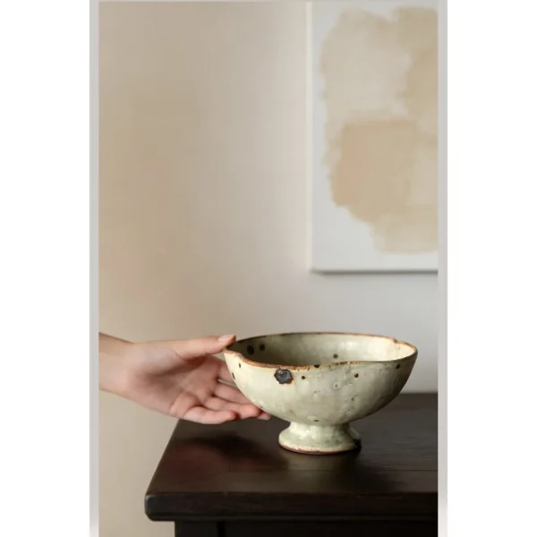 Artist Collaboration Grey-Green Iron-Spot Stoneware Bowl in olive — in a room setting