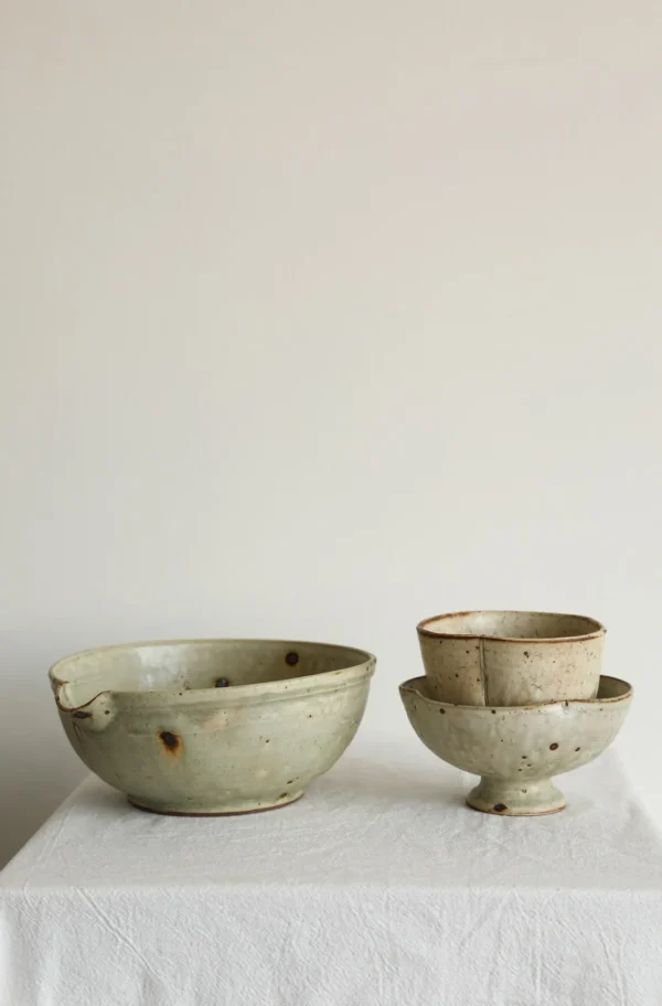 Artist Collaboration Grey-Green Iron-Spot Stoneware Bowl in olive — in a room setting