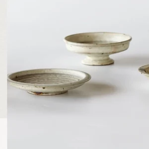 Artist Collaboration Green-Glaze Stoneware Footed Plates in olive — front view