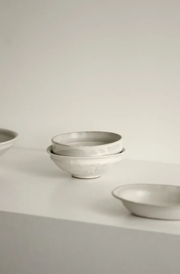 Artist Collaboration Kohiki White-Slip Ceramic Bowls in ivory — in a room setting