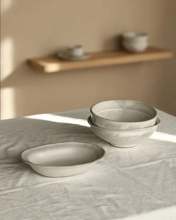 Artist Collaboration Kohiki White-Slip Ceramic Bowls in ivory — in a room setting