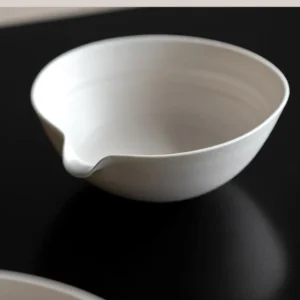 Artist Collaboration Cream Ceramic Pouring Bowl in oatmeal — front view