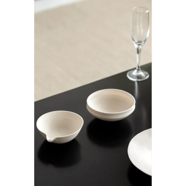 Artist Collaboration Cream Ceramic Pouring Bowl in oatmeal — in a room setting